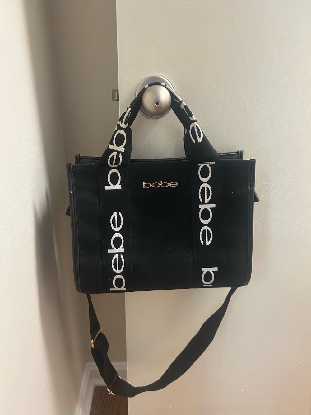 Bebe Canvas Top Handle
Crossbody Bag